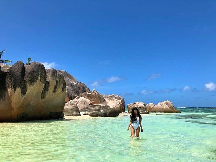 MAMAMOO's Hwasa Slays on The Beach in a White One-Piece