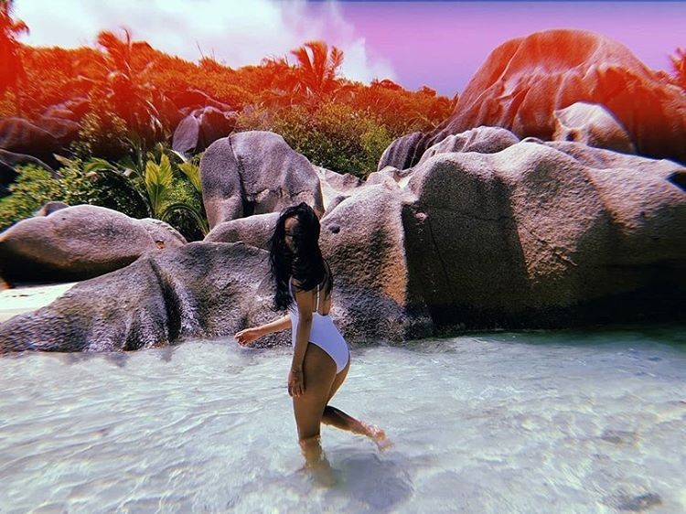 MAMAMOO's Hwasa Slays on The Beach in a White One-Piece