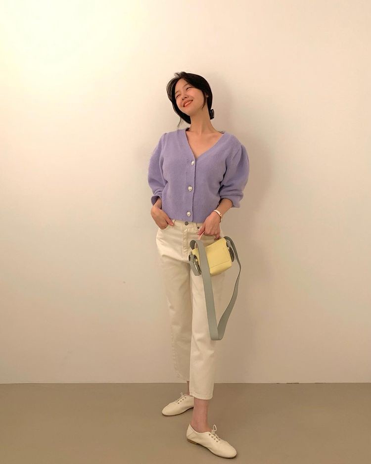 Minah, wearing a light purple knit, smiling eyes
