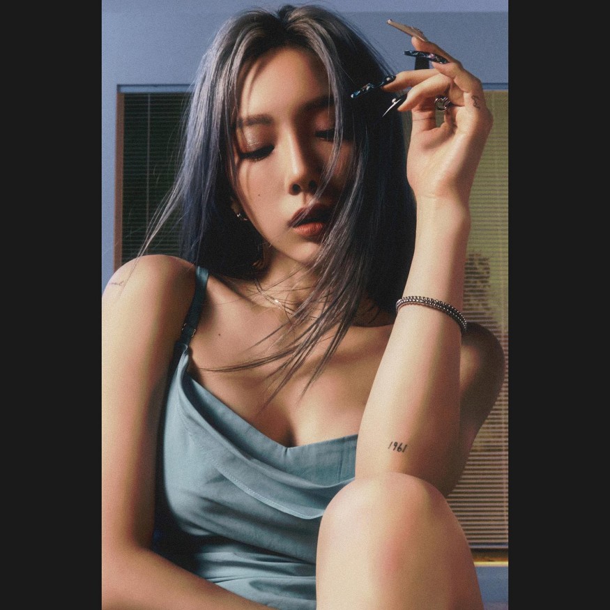 Taeyeon radiates sexy beauty in slips under blue lights