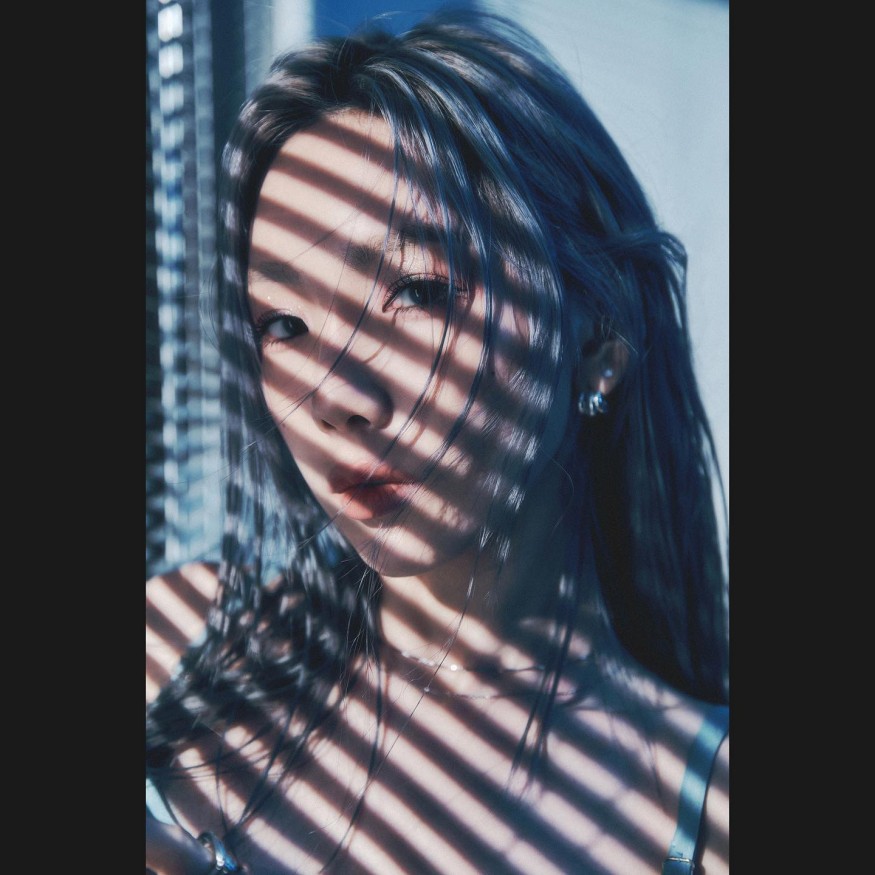 Taeyeon radiates sexy beauty in slips under blue lights