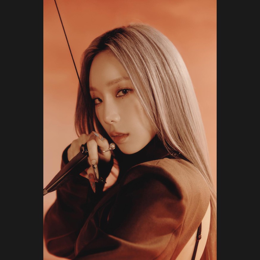 Taeyeon radiates sexy beauty in slips under blue lights