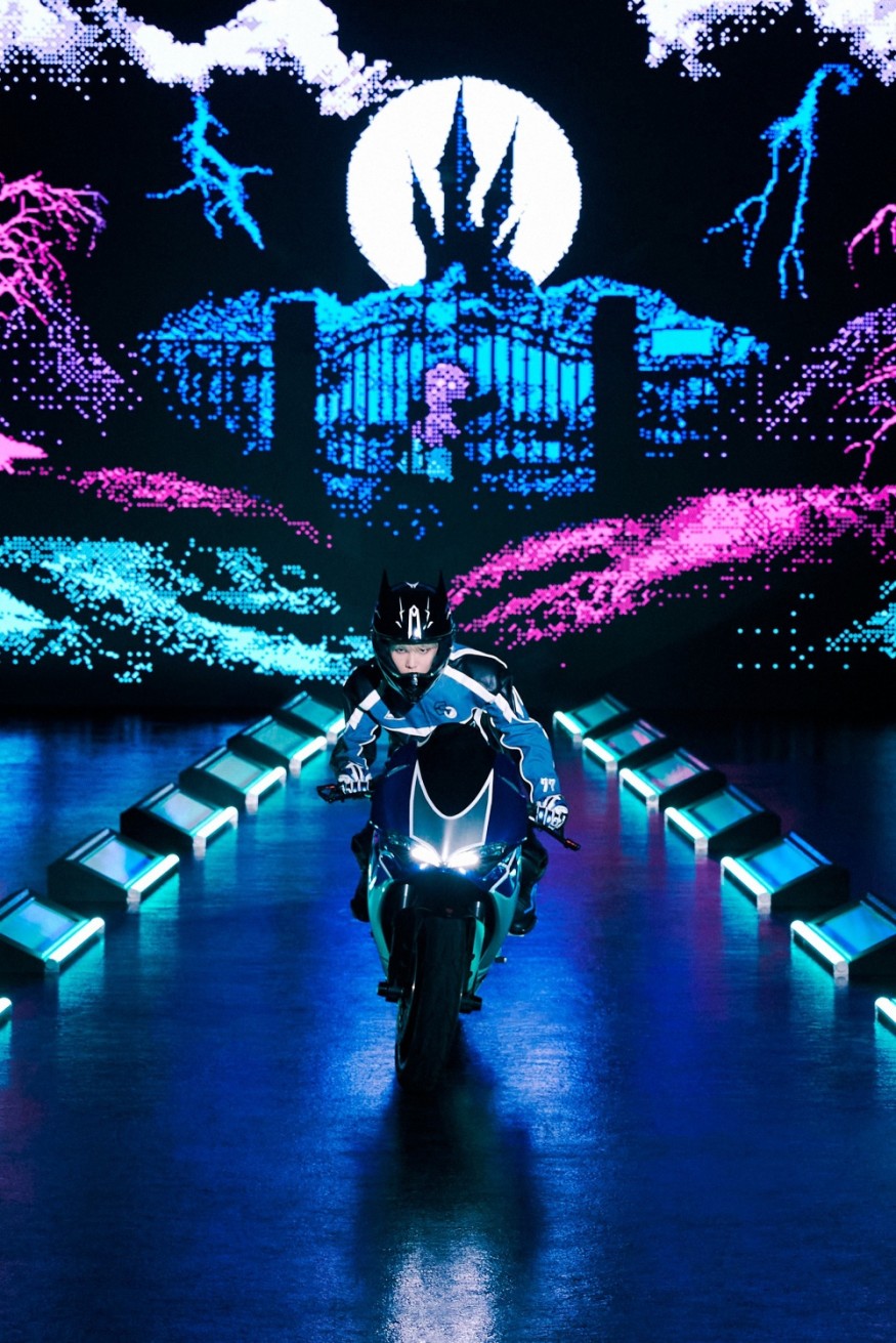 Key, this time darkly... 'Charisma' riding a bike