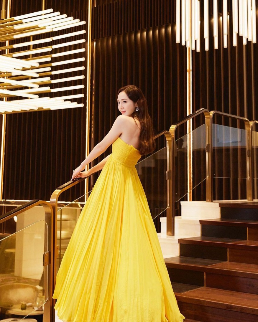 Jessica Jung, wearing a dazzling yellow dress and smiling... sexy + elegant